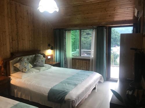 Imagen de la habitación del Anji Mingquan Hotel. Foto 9