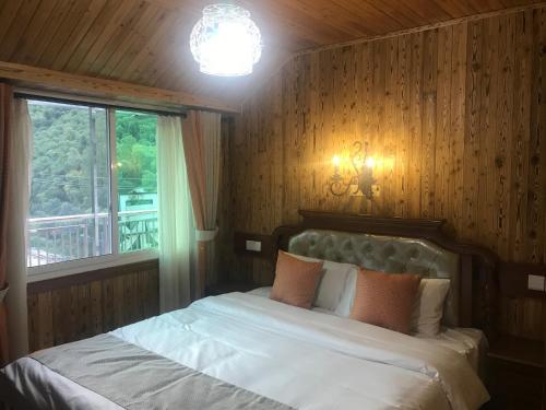 Imagen de la habitación del Anji Mingquan Hotel. Foto 10