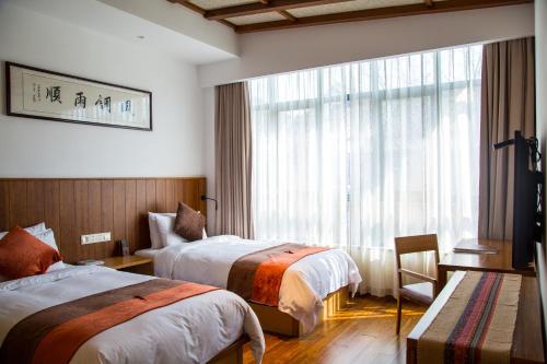 Imagen de la habitación del Anji Paradise Spring And Autumn Resort. Foto 10