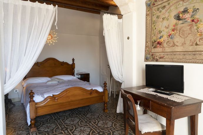 Imagen de la habitación del Antico Mondo Rooms and Suites. Foto 12