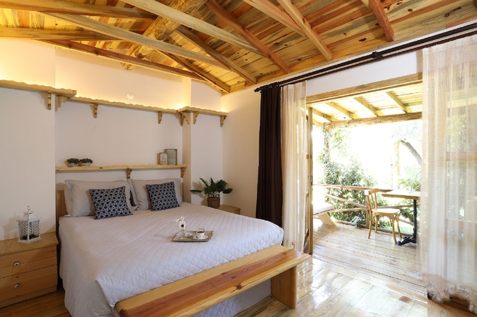 Imagen de la habitación del Antique Beach and Bungalow. Foto 15