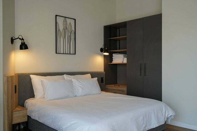 Imagen de la habitación del Apartique Hotel. Foto 13