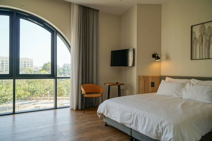 Imagen de la habitación del Apartique Hotel. Foto 14