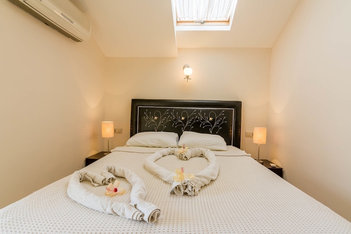 Imagen de la habitación del Apollonium Spa and Beach Resort. Foto 12