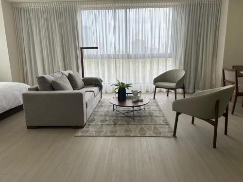 Imagen de la habitación del Arcadia Condo Suites. Foto 11