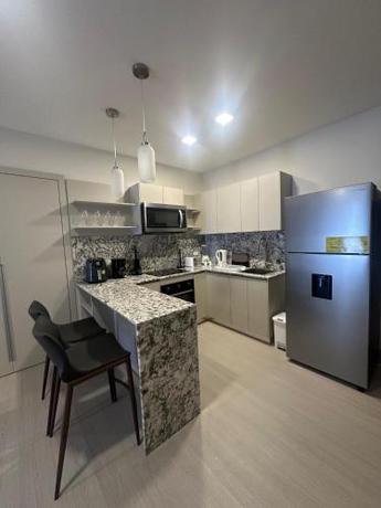 Imagen de la habitación del Arcadia Condo Suites. Foto 19