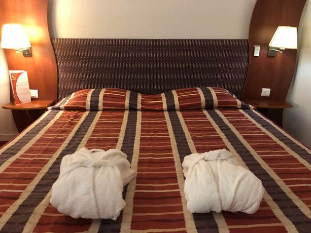 Imagen de la habitación del Art&eacute;mis H&ocirc;tel and Spa Bistro Coquet. Foto 10