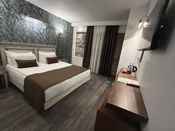 Imagen de la habitación del Assos Troy Port Hotel. Foto 20