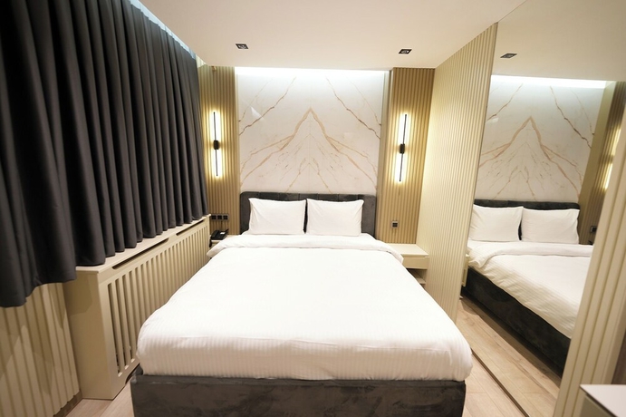 Imagen de la habitación del Assyria Hotel. Foto 8