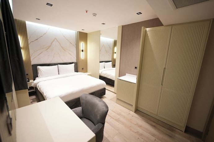 Imagen de la habitación del Assyria Hotel. Foto 10
