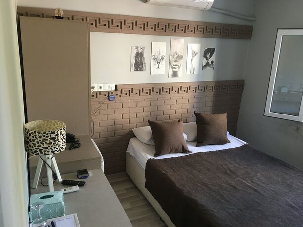 Imagen de la habitación del Asus Palmiye Otel. Foto 14