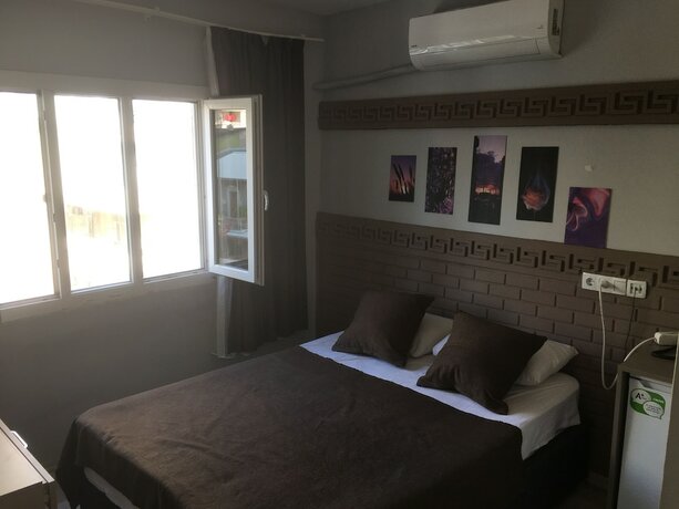 Imagen de la habitación del Asus Palmiye Otel. Foto 15
