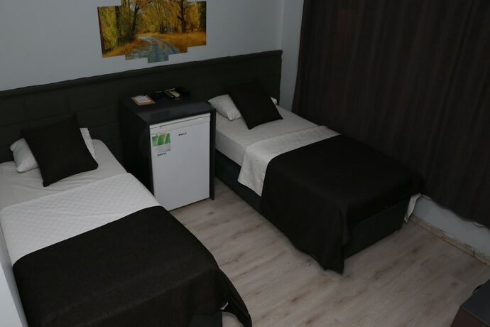 Imagen de la habitación del Asus Palmiye Otel. Foto 16