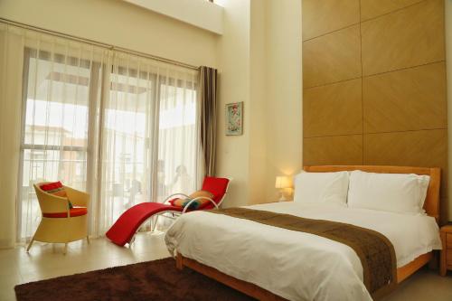 Imagen de la habitación del At Home Service Apartment Wanning Shenzhou Bandao. Foto 6