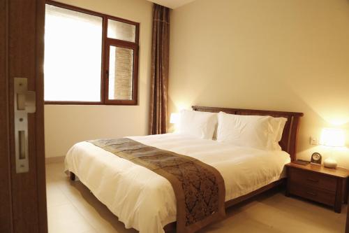 Imagen general del At Home Service Apartment Wanning Shenzhou Bandao. Foto 3