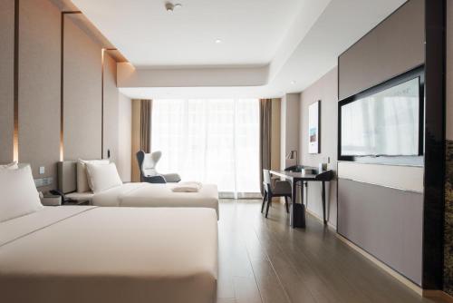 Imagen de la habitación del Atour Hotel Taian Taishan Scenic Area Pangu Tiandi. Foto 18
