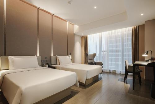 Imagen de la habitación del Atour Hotel Taian Taishan Scenic Area Pangu Tiandi. Foto 19