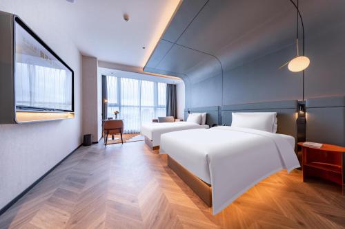 Imagen de la habitación del Atour S Hotel Ningbo Binjiang Olympic Sports Center. Foto 10