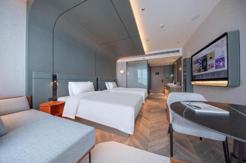 Imagen de la habitación del Atour S Hotel Ningbo Binjiang Olympic Sports Center. Foto 12