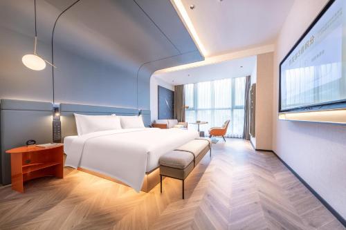 Imagen de la habitación del Atour S Hotel Ningbo Binjiang Olympic Sports Center. Foto 13