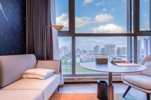 Imagen de la habitación del Atour S Hotel Ningbo Binjiang Olympic Sports Center. Foto 14