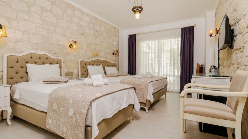 Imagen de la habitación del Avlu Alacati Butik Otel. Foto 11