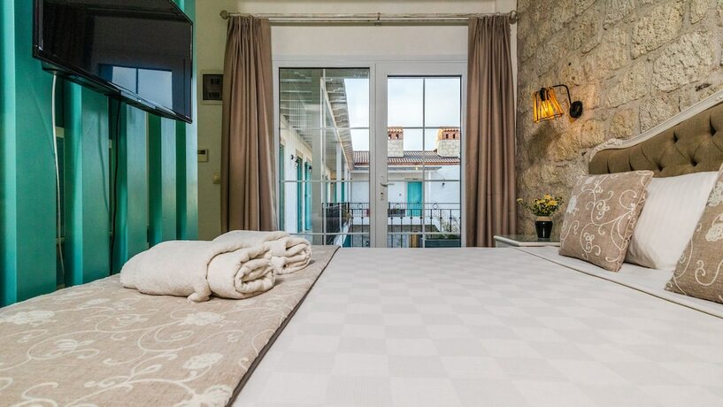 Imagen de la habitación del Avlu Alacati Butik Otel. Foto 16