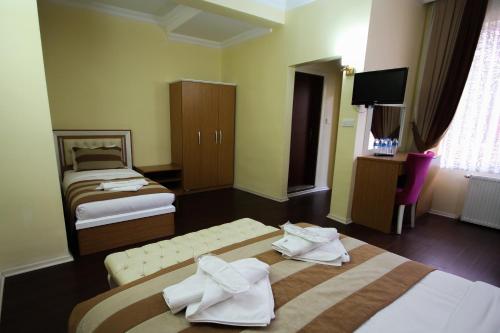 Imagen de la habitación del Azre Hotel. Foto 6