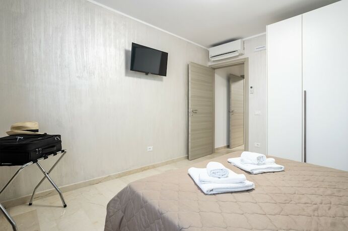 Imagen de la habitación del Azzurra Apartments. Foto 19