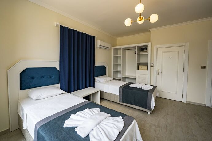 Imagen de la habitación del BLUE PEARL HOTELand VILLAS. Foto 17