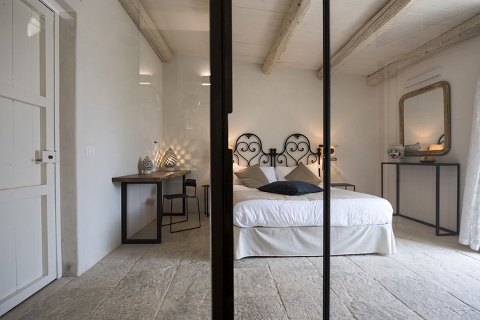 Imagen de la habitación del Baglio Siciliamo Country House. Foto 11