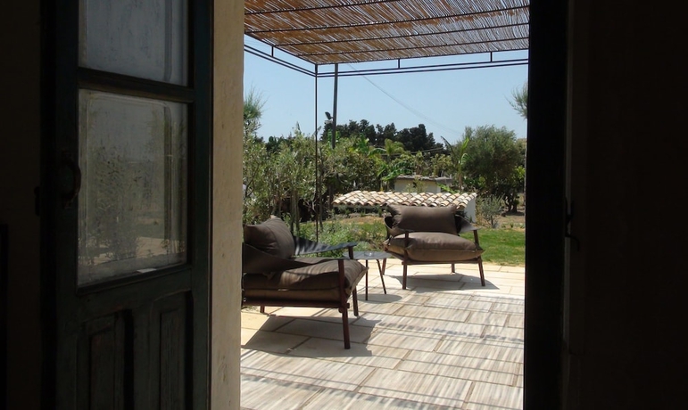 Imagen de la habitación del Baglio Siciliamo Country House. Foto 15