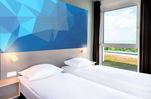 Imagen de la habitación del B&B HOTEL Offenburg-Hbf. Foto 11