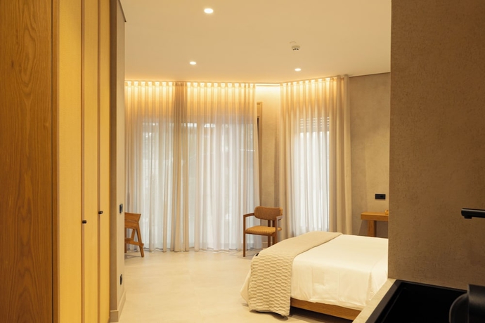 Imagen de la habitación del Beau Rivage Suites. Foto 14