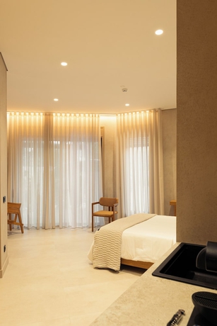 Imagen de la habitación del Beau Rivage Suites. Foto 15