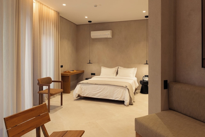 Imagen de la habitación del Beau Rivage Suites. Foto 16