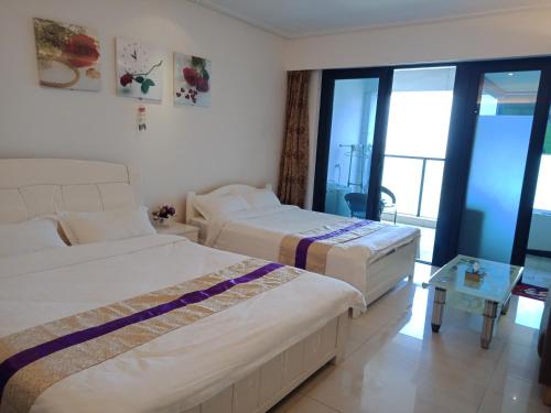 Imagen de la habitación del Beibuwan Yihao Jingxuan Sea View Apartment. Foto 4