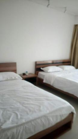 Imagen de la habitación del Beibuwan Yihao Jingxuan Sea View Apartment. Foto 5