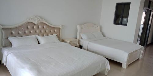 Imagen de la habitación del Beibuwan Yihao Jingxuan Sea View Apartment. Foto 7