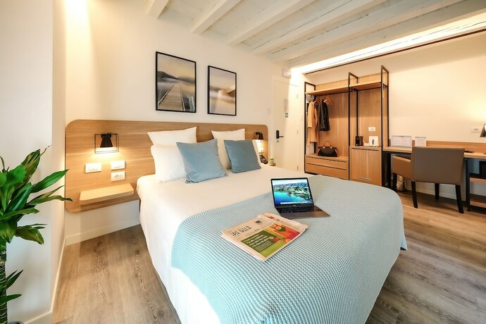 Imagen de la habitación del Bergamo Inn 15. Foto 17