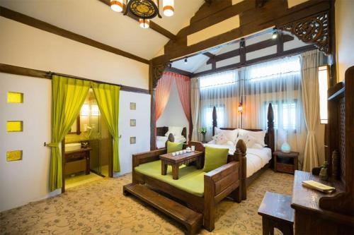 Imagen de la habitación del Big Tree Guesthouse - Naxi old style. Foto 11
