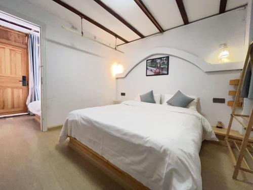 Imagen de la habitación del Big Tree Guesthouse - Naxi old style. Foto 20