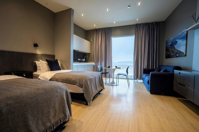 Imagen de la habitación del Black Beach Suites. Foto 14