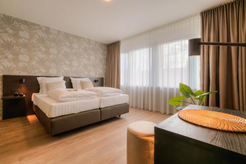 Imagen de la habitación del Bloomhotel. Foto 7