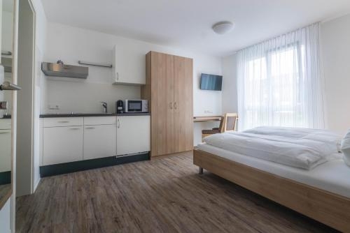 Imagen de la habitación del Boardinghouse N22 Oberboihingen. Foto 7