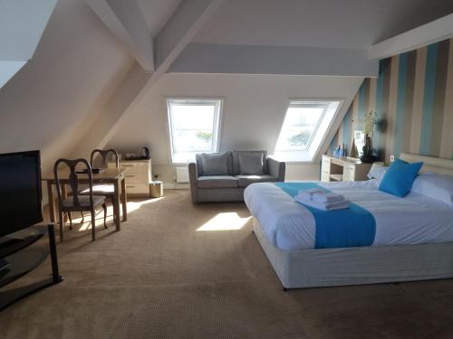 Imagen de la habitación del Boathouse Hotel. Foto 9