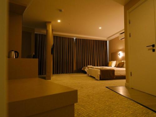 Imagen de la habitación del Bonnie City Hotel. Foto 17