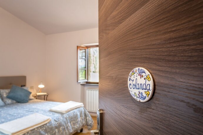 Imagen de la habitación del Borgo Pulciano Agriturismo. Foto 11