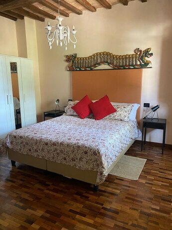 Imagen de la habitación del Borgo Pulciano Agriturismo. Foto 13