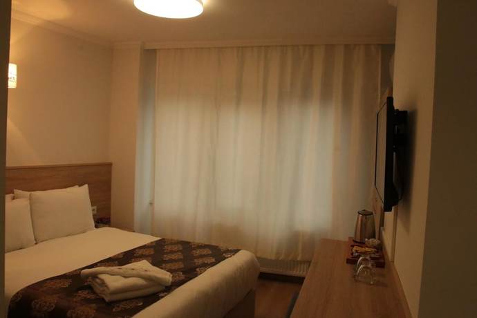 Imagen de la habitación del Bufes Hotel. Foto 19